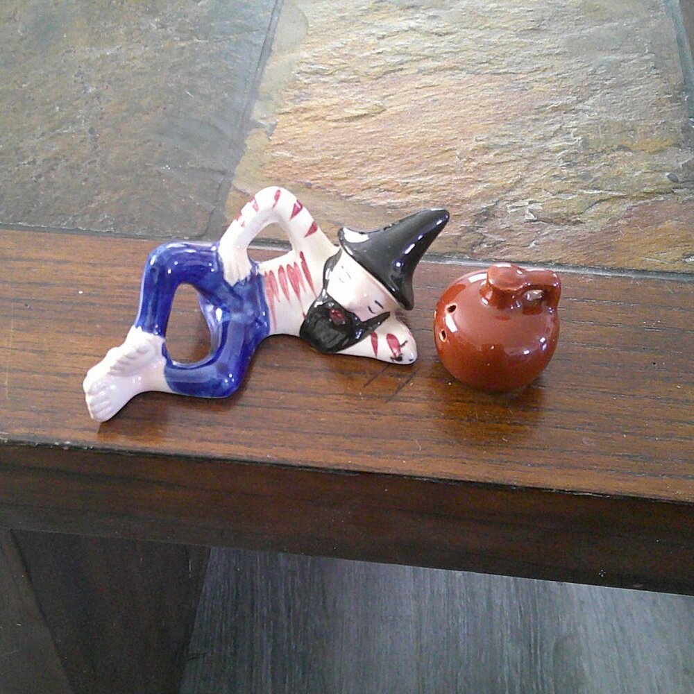 Vintage set of salt and pepper shakers, reclining "hillbilly" and moonshine jug